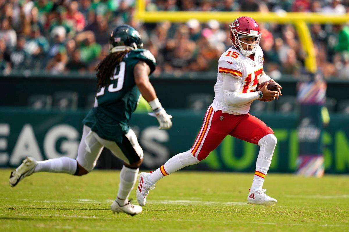Kansas City Chiefs quarterback Patrick Mahomes is chased by Philadelphia Eagles safety Avonte Maddox during the second half of Sunday’s game.