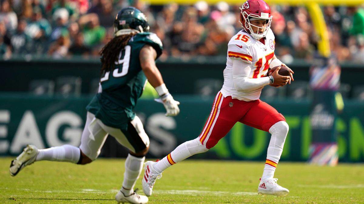 Kansas City Chiefs quarterback Patrick Mahomes is chased by Philadelphia Eagles safety Avonte Maddox during the second half of a game in 2021.