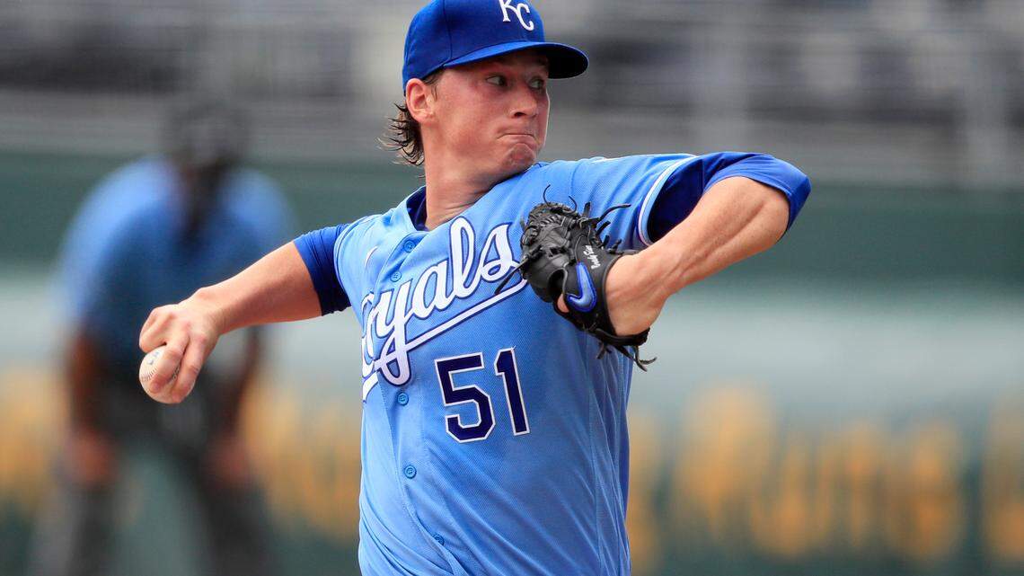 Kansas City Royals starting pitcher Brady Singer delivers to a Minnesota Twins batter during the first inning of a baseball game at Kauffman Stadium in Kansas City, Mo., Sunday, Aug. 9, 2020. (AP Photo/Orlin Wagner)