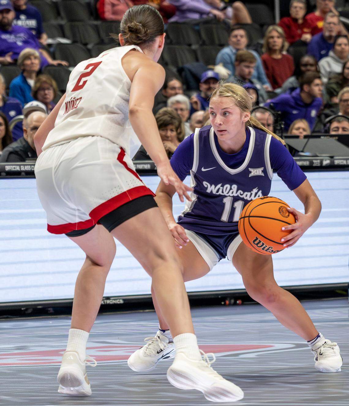 Kansas State Wildcats guard Taryn Sides (11) dribbles up the court as Texas Tech Red Raiders guard Gemma Nunez (2) defends during the fourth quarter of the Big 12 Women's Basketball Tournament at T-Mobile Center on Thursday, March 5, 2026, in Kansas City.