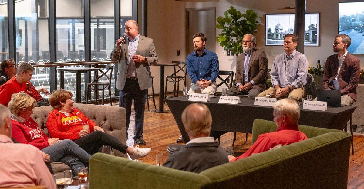 Greg Farmer, The Star’s executive editor, from left, introduces Chiefs writers and columnists Jesse Newell, Vahe Gregorian, Blair Kerkhoff and Sam McDowell to subscribers at an event at J. Rieger & Co. distillery.