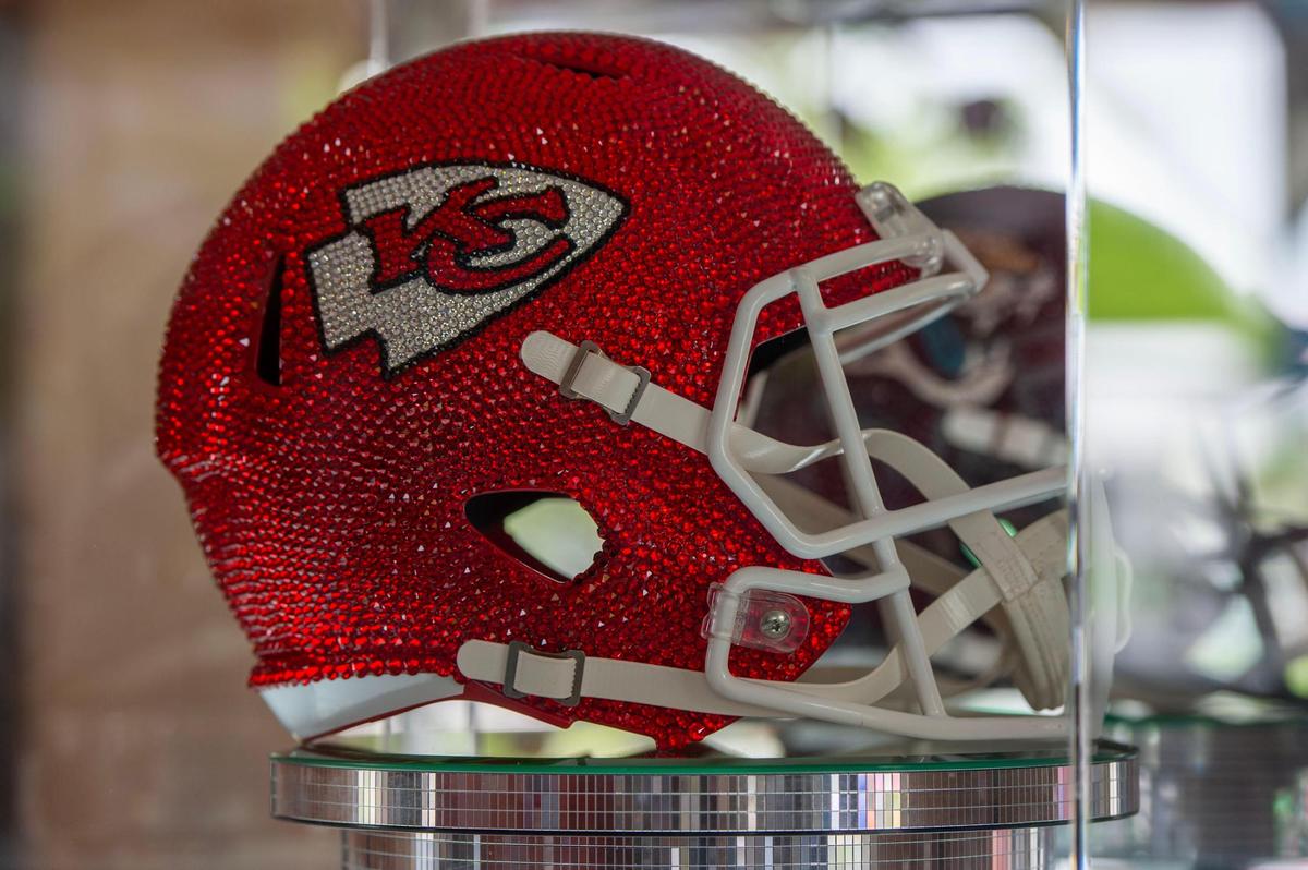 A bejeweled Kansas City Chiefs helmet is displayed at the NFL Draft Experience gallery,.
