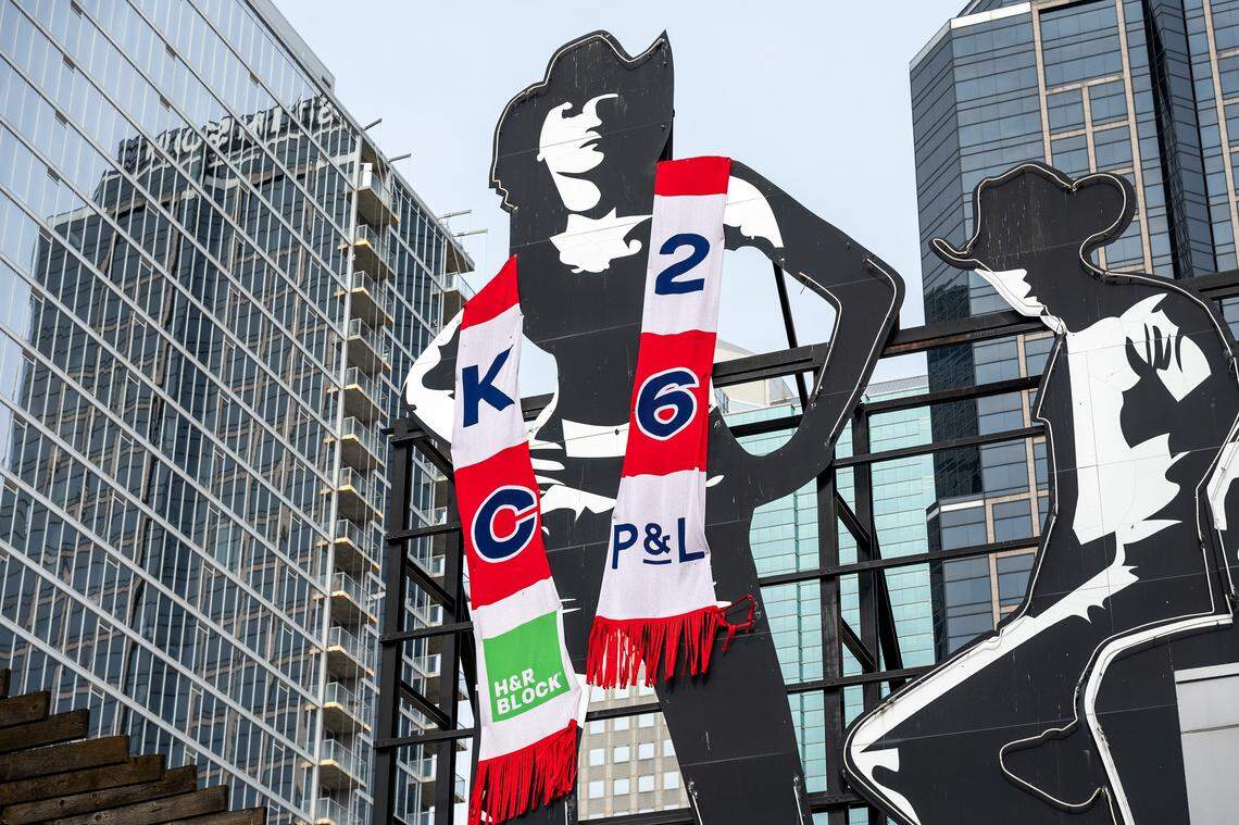 A PBR Big Sky cowgirl figures is seen wrapped in a custom-knit scarf at the Kansas City Power & Light District on Sunday, March 1, 2026.