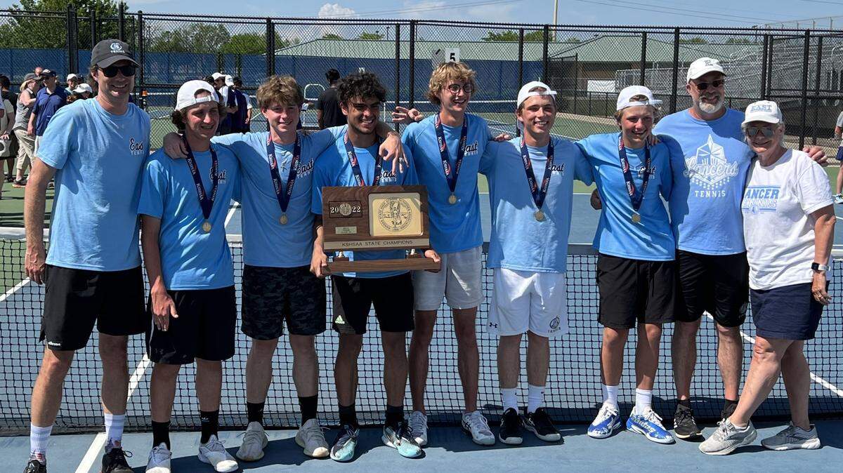 Led by Gregor Wiedeman’s state singles championship on Saturday at the College Boulevard Activities Center in Olathe, the Shawnee Mission East Lancers claimed the Kansas state title for Class 6A. Wiedeman is the one holding the trophy.