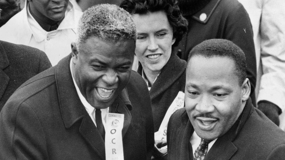 Jackie Robinson wore an Organization for Civil Rights badge when he took part in a Louisville march with Dr. Martin Luther King in 1964.