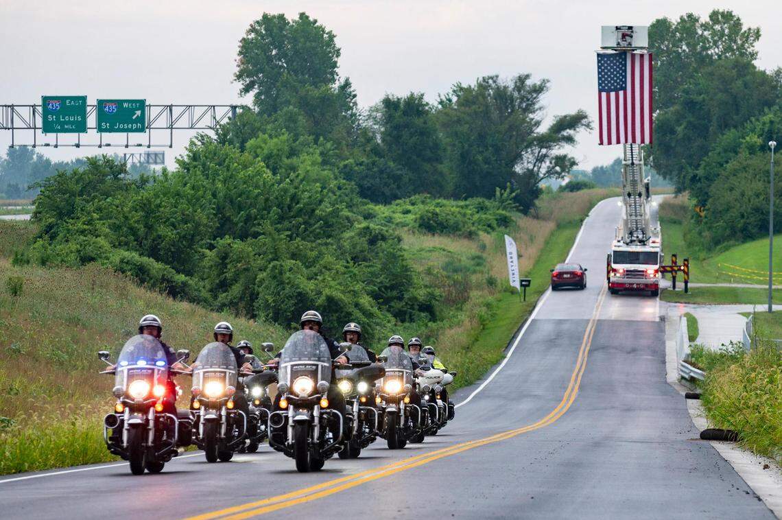 Police officers leave after attending the public visitation held at Vineyard Church for North Kansas City Police Department Officer Daniel Vasquez, who was killed while on duty in July 2022