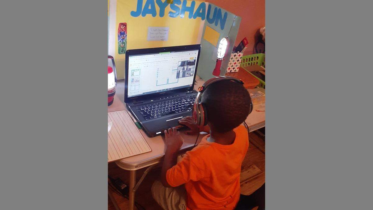 Jayshaun Jones, 5, and his twin, Jayceon, have been attending kindergarten online from their Kansas City home because of COVID-19. Now with their school going back to in-person classes this month, their mom, Cakeila Jones, is nervous about whether it will be safe.