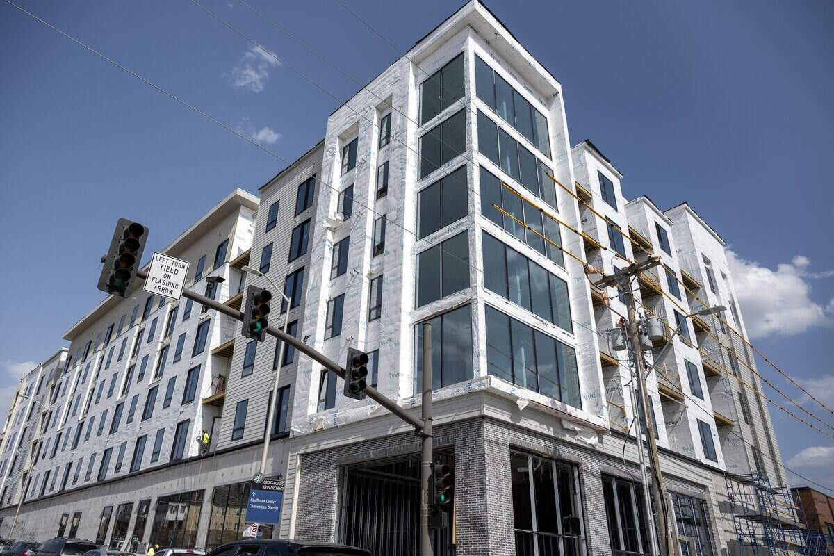 Construction is underway on an apartment building along Broadway Boulevard and 20th Street, Friday, March 14, 2025, in Kansas City.