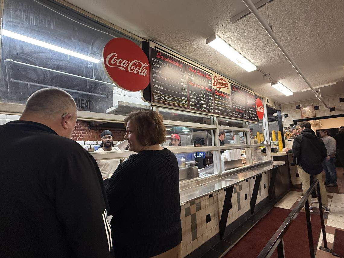 Customers at Arthur Bryant’s wait in line on its reopening day Friday.