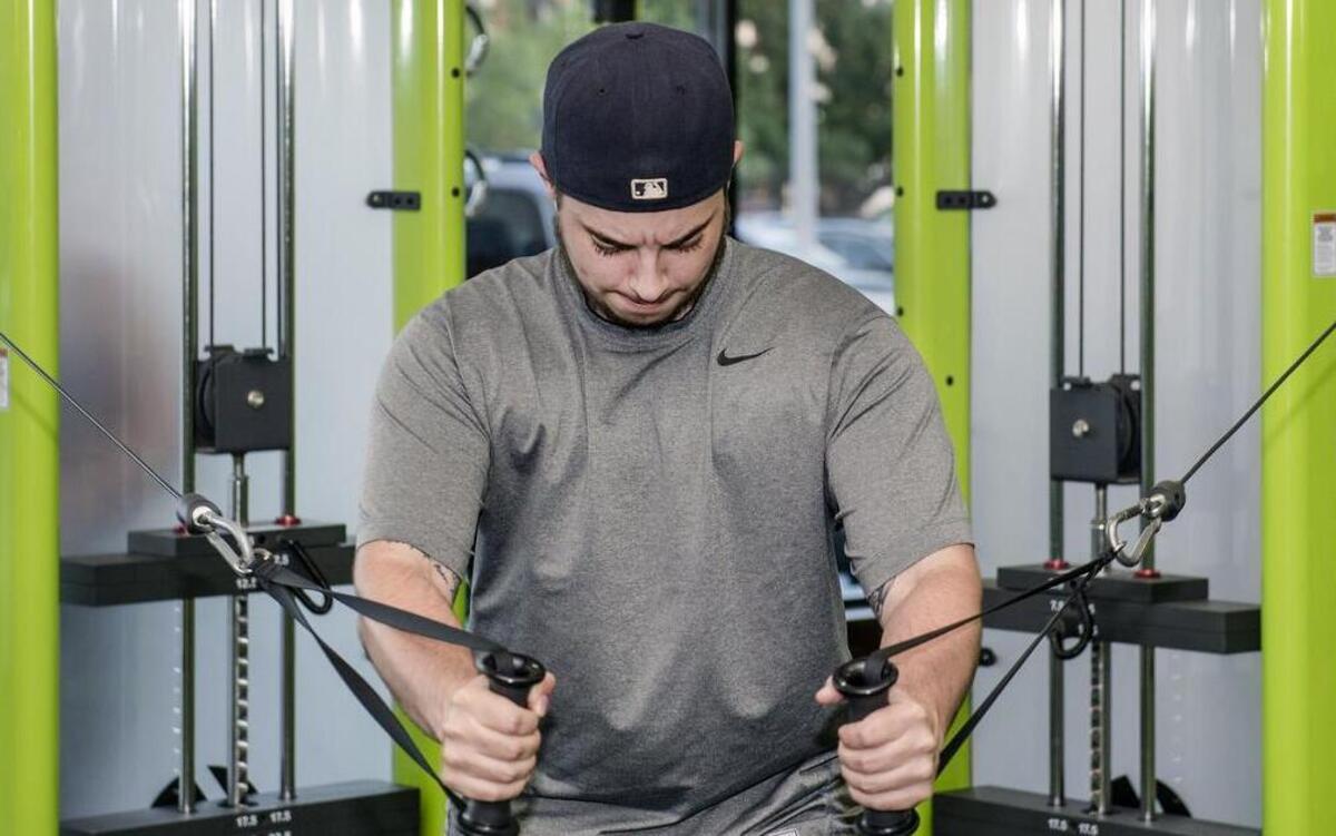
Jake Nothnagel works out at City Gym, 7416 Wornall Road, in Kansas City. Hailee Bland-Walsh, the gym’s owner, and Drew Smith developed a workout regimen aimed at addressing the fitness challenges of transgender men. 
