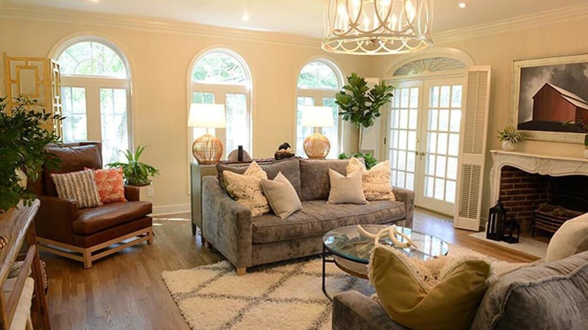 The living room of the first home in the DIY Network series “Bargain Mansions” is now bright and airy.