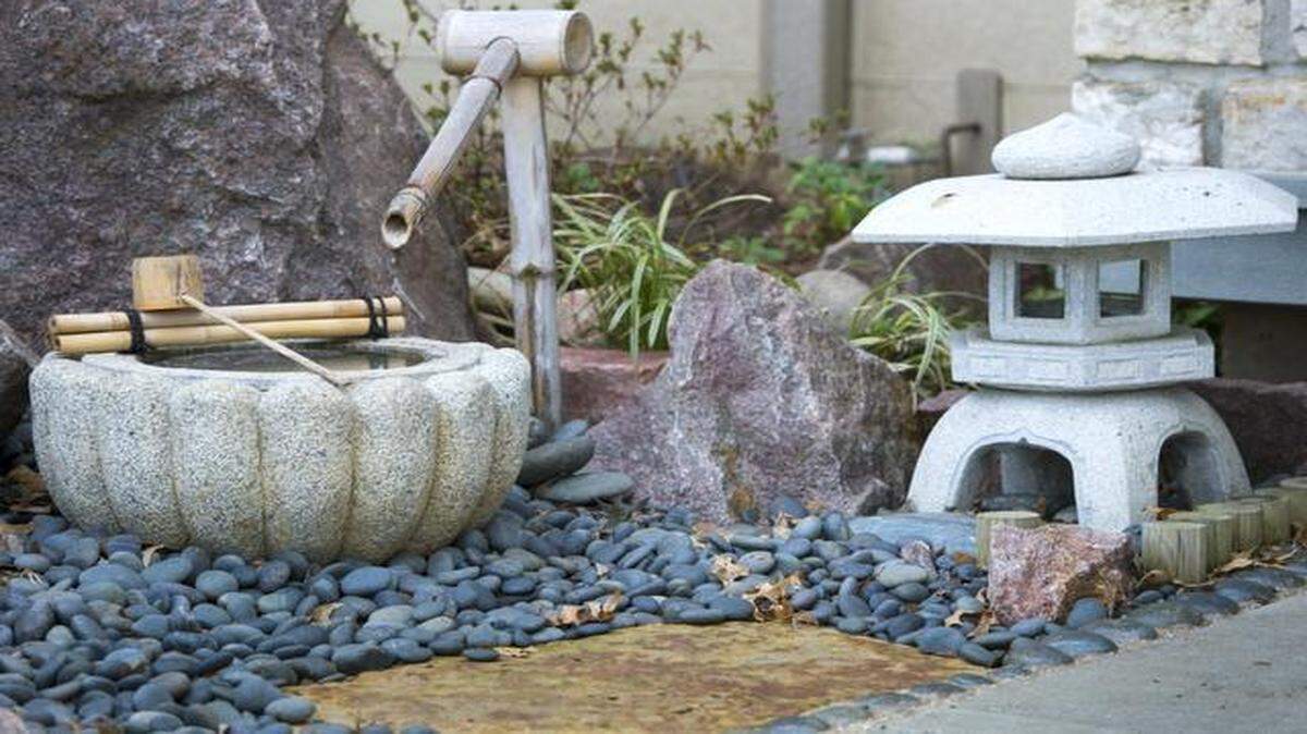 
Tsukubais, like this one in the garden in front of the Prairie Village home of Fran Lemery, an honorary consul general of Japan, are for washing and purification before entering Japanese homes. 
