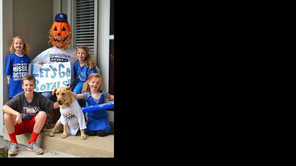 
 Here’s Chris, Molly, Anna and Sara Scheibel and their dog Sandy celebrating the Royals’ victory over the Orioles. 
