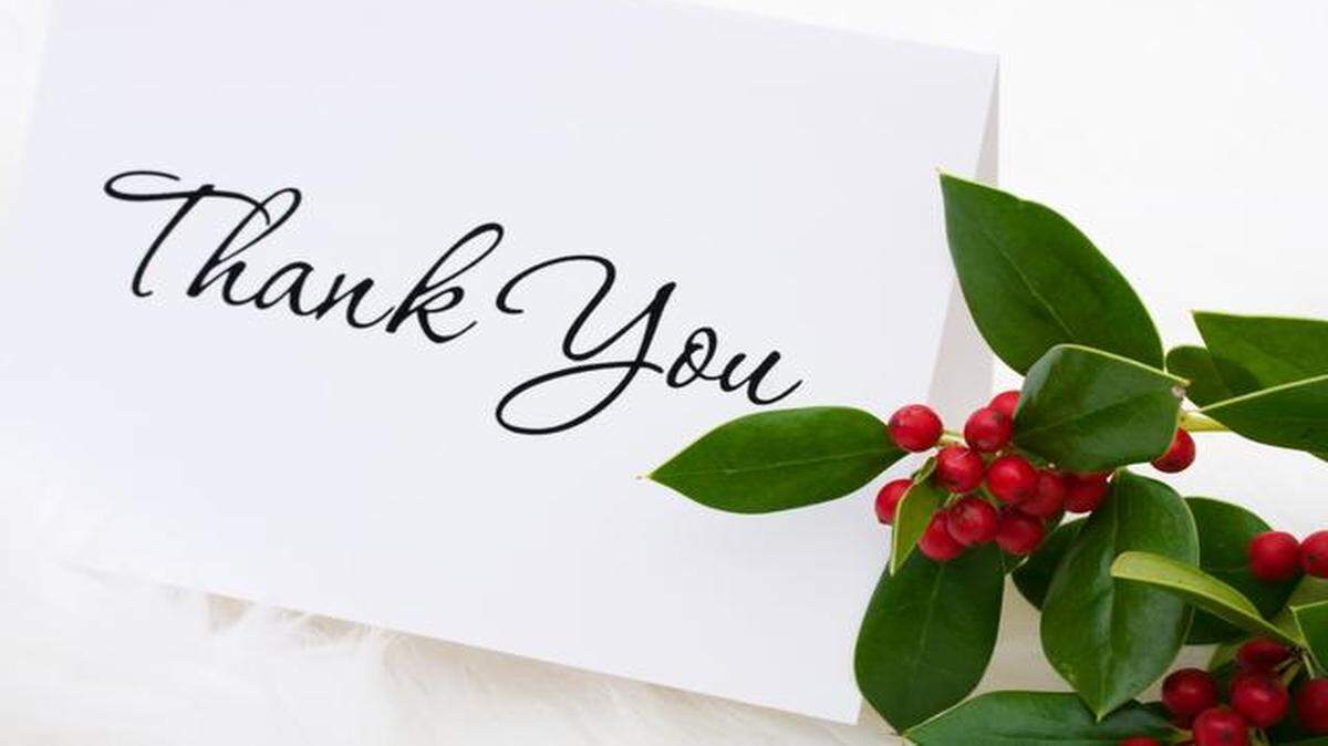 
A thank you card with holly and berries on a white fur background thank you card
