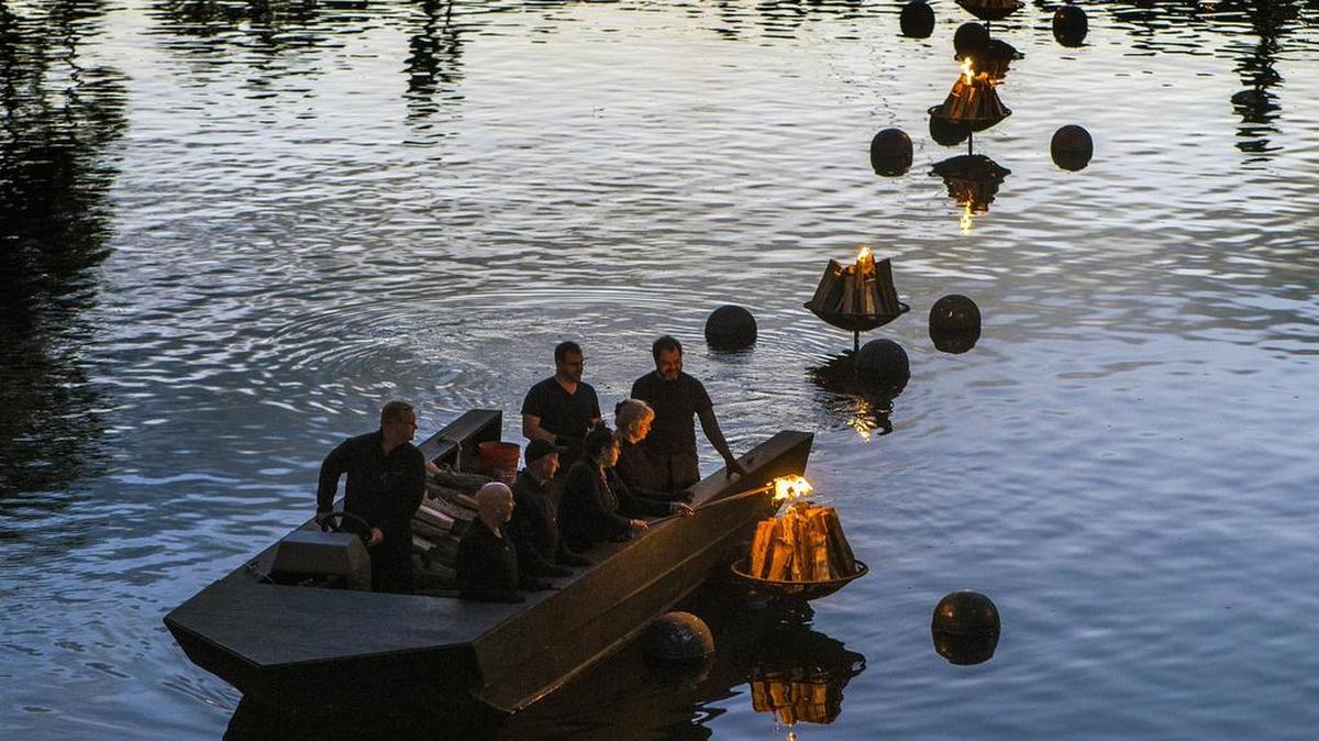 Boaters light braziers floating in Brush Creek during WaterFire KC in 2016. This year’s event will be held Oct. 6.
