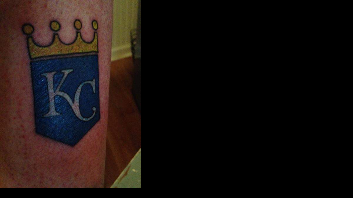 
Devin Young of Midtown, a 39-year-old bartender and DJ, received the first free Royals tattoo on Thursday on his right calf.
