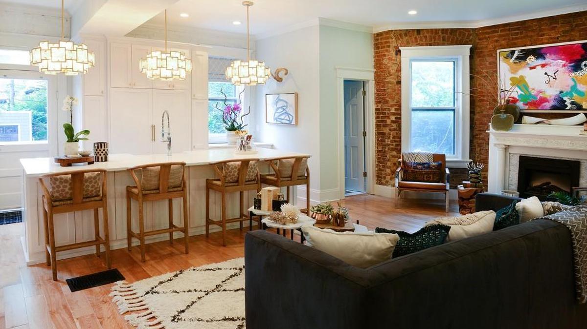 Day removed a wall in the living room which has an exposed brick wall so it opens onto the kitchen.