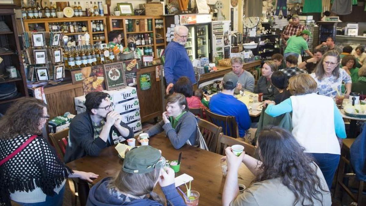 John McClain (standing in the middle) co-owns Browne’s Irish Marketplace with his wife, Kerry Browne. The deli and store is a center for Irish culture in Kansas City and has been in Browne’s family for six generations.