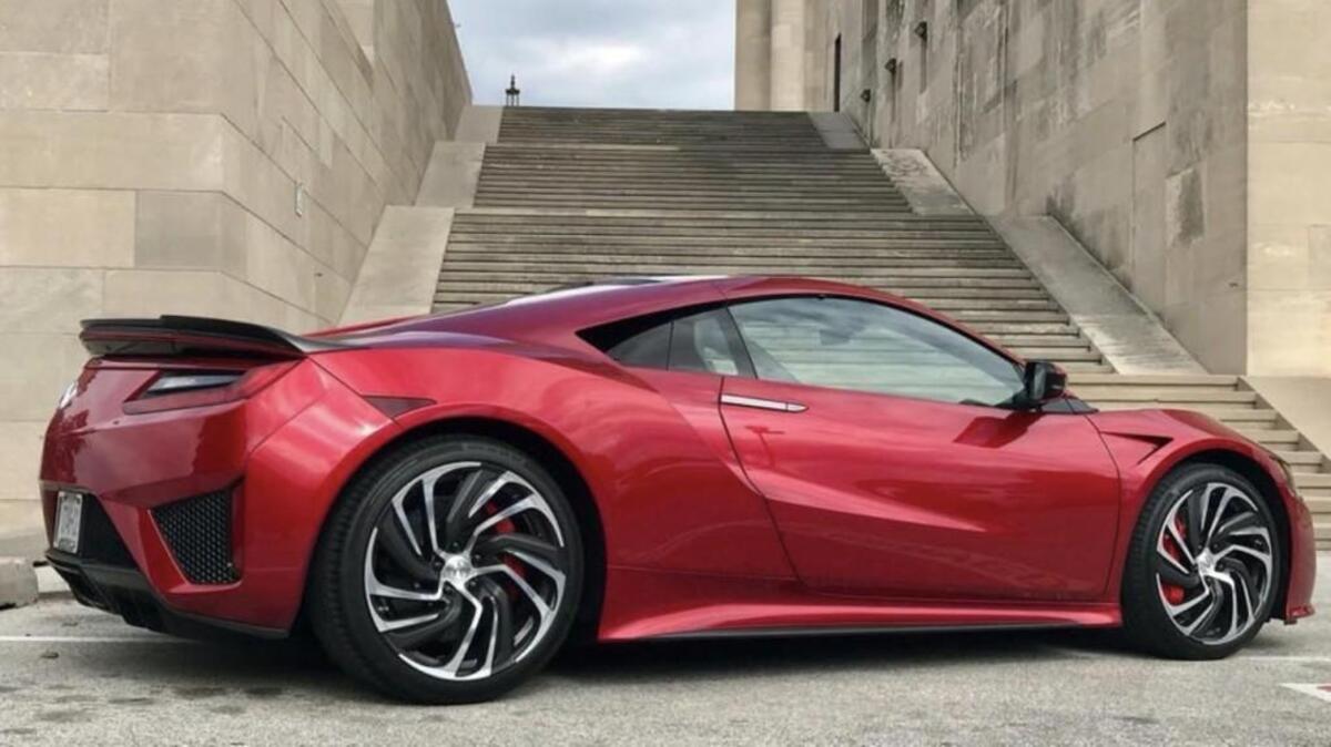 The 2017 Acura NSX coupe is a hybrid car that features a twin-turbo engine, three electric motors and dual-clutch transmission. According to Acura, it can reach 60 mph in about 3 seconds and go as fast as 191 mph.