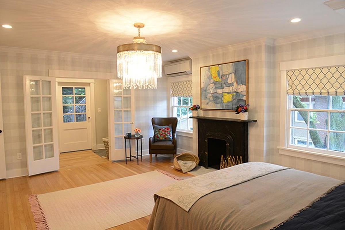 The master bedroom now features soft gray checkered wallpaper.