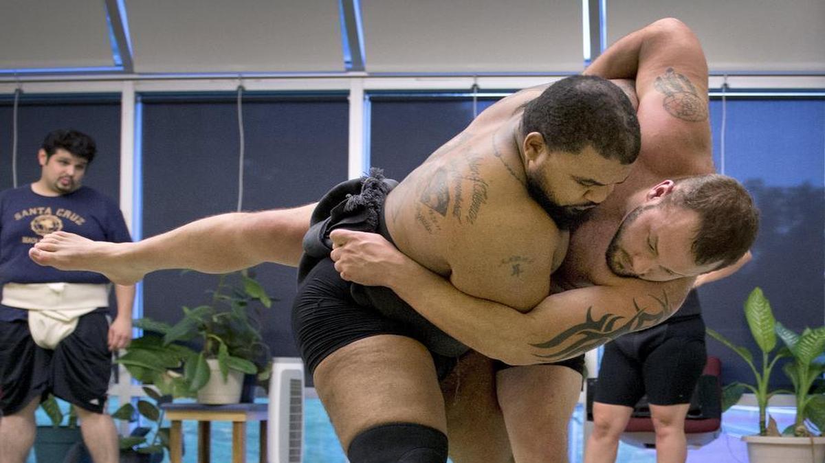 
Sumo coach André Coleman (left) was moments away from victory as he practiced with assistant coach Derek Jeffries. Both will compete in the U.S. Sumo Open.
