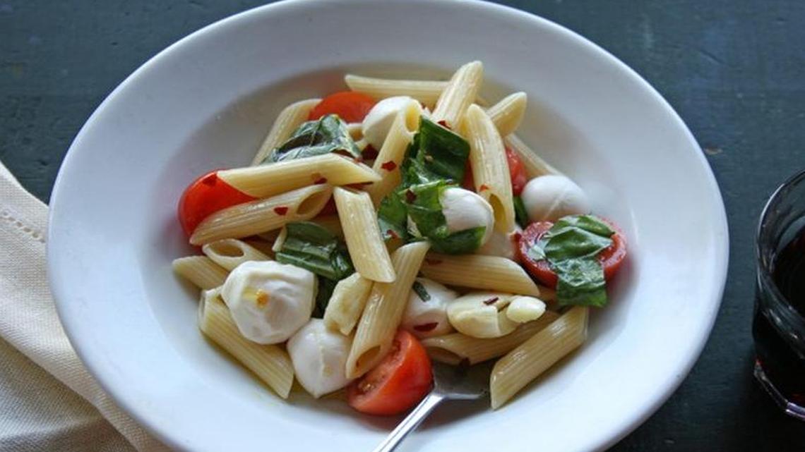 
Cherry tomatoes, fresh mozzarella and basil make a quick pasta for busy summer nights.

