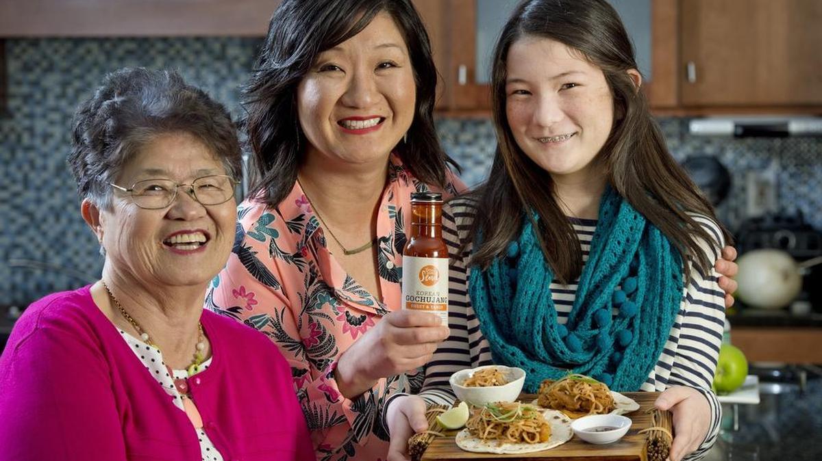 Angela Hong (center) of Born With Seoul gochujang sauces used her mother Becky Hong’s (left) recipe with a few twists. With them is Angela’s daughter, Isabel Crofoot.