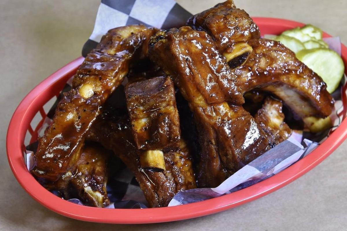 Baby Back Rib Basket: Piled high and tossed in competition-style glaze with pickles on the side.