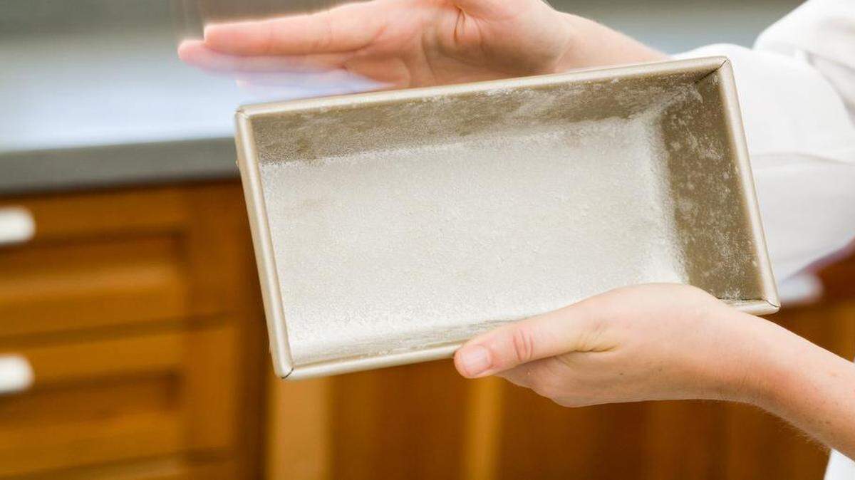 
1. Grease and flour the pan: A dusting of flour helps the pound cake batter climb the sides of the pan evenly and prevents the edges from forming a hard, crusty lip.
