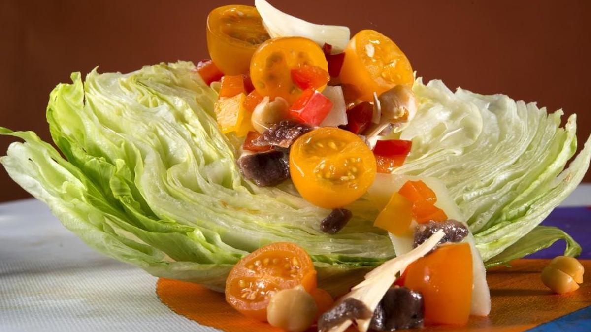 Italian Wedge, featuring garbanzo beans, anchovies, cherry tomatoes and bell peppers.