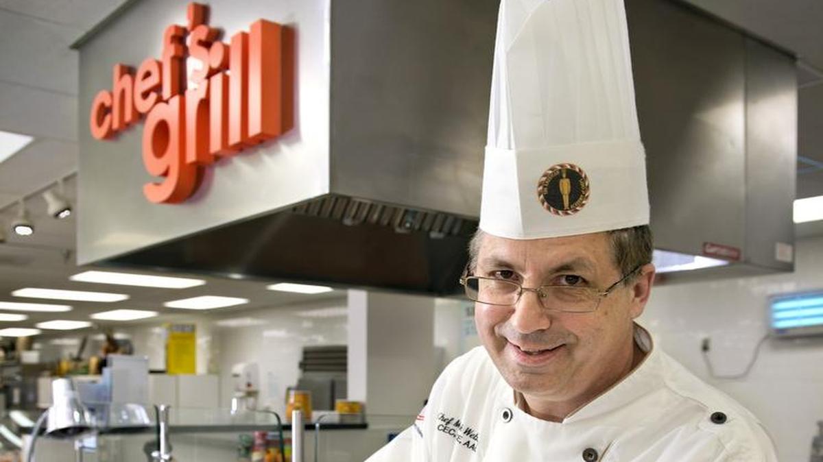 Chef Mark Webster serves up Cedar-Planked Cod to supermarket shoppers.