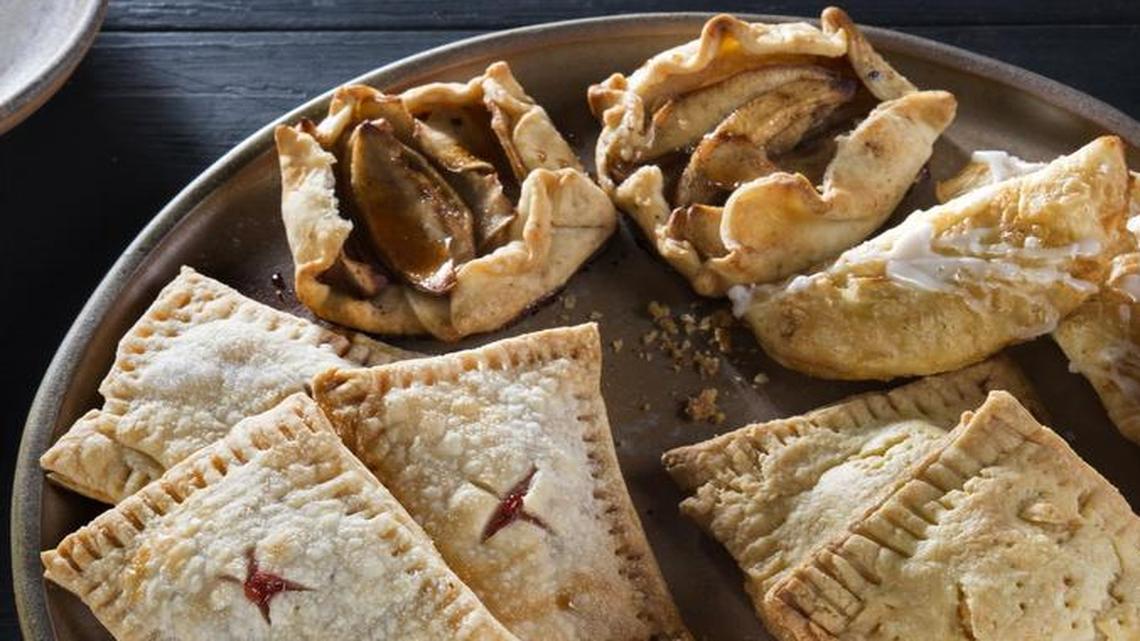 Strawberry Hand Pies (clockwise from left), Hand-Held Apple Galette, Maple-Glazed Pumpkin Hand Pies, Chicken and Swiss Tarts.