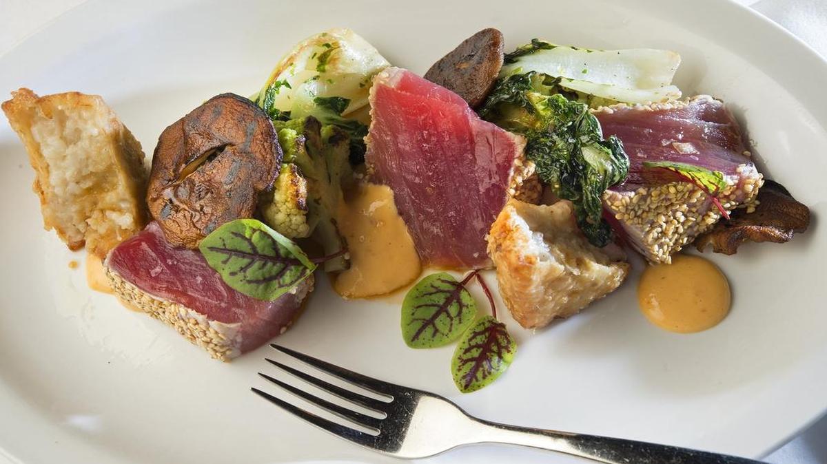 
Rare benne-crusted ahi tuna gets seasonal accompaniments, including wood sorrel. 
