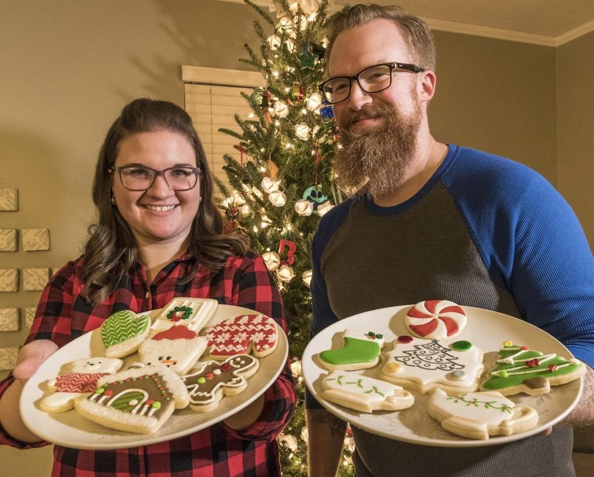 Festive sugar cookies are a team effort: Deborah Bryson of Gladstone decorates them and husband Kirk Bryson mixes and bakes them.