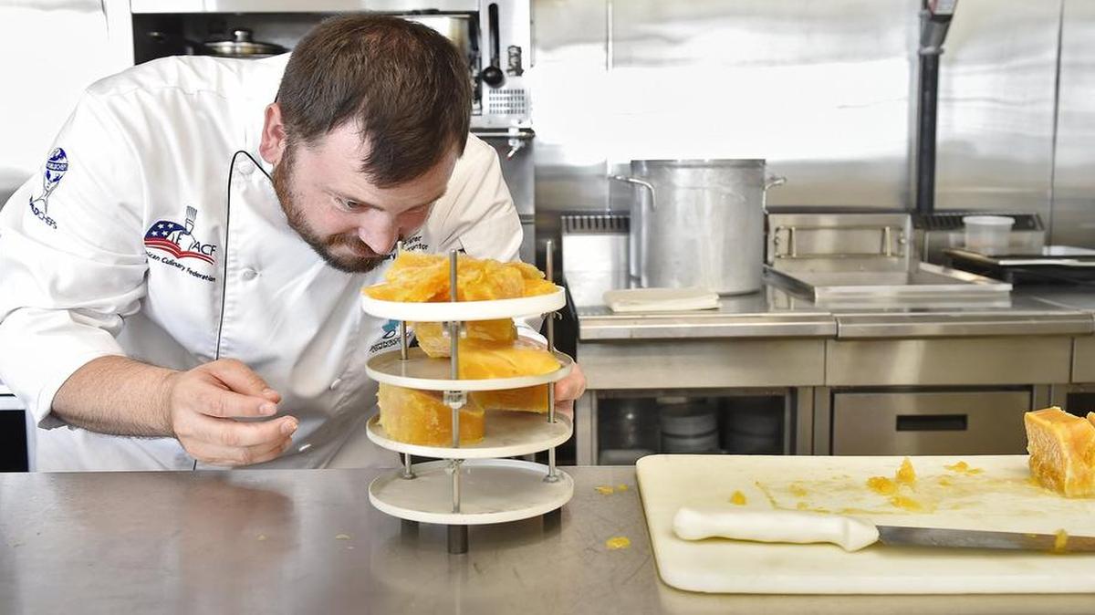 

JCCC culinary instructor Aaron Prater prepares passion fruit puree for the freeze dryer, a new piece of equipment in the college’s Innovation Kitchen.
