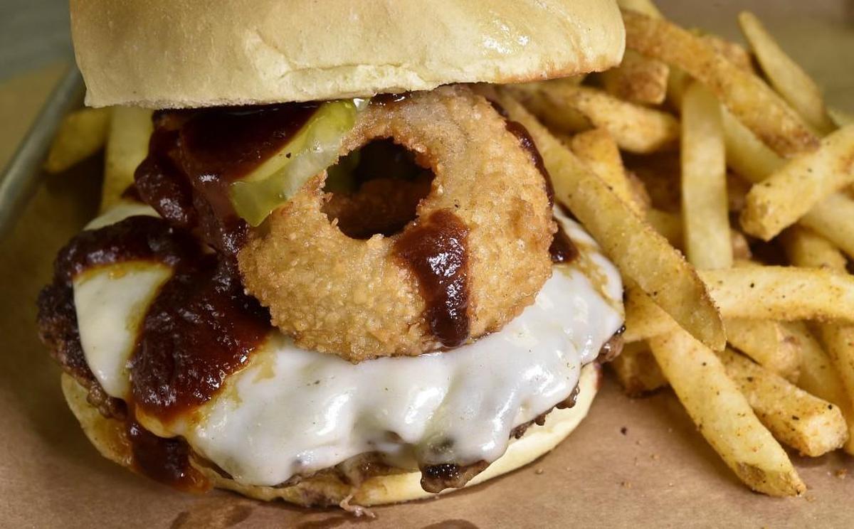 Z-Man Burger: Joe’s Kansas City bbq sauce, smoked provolone, fried onion rings and dill pickles.