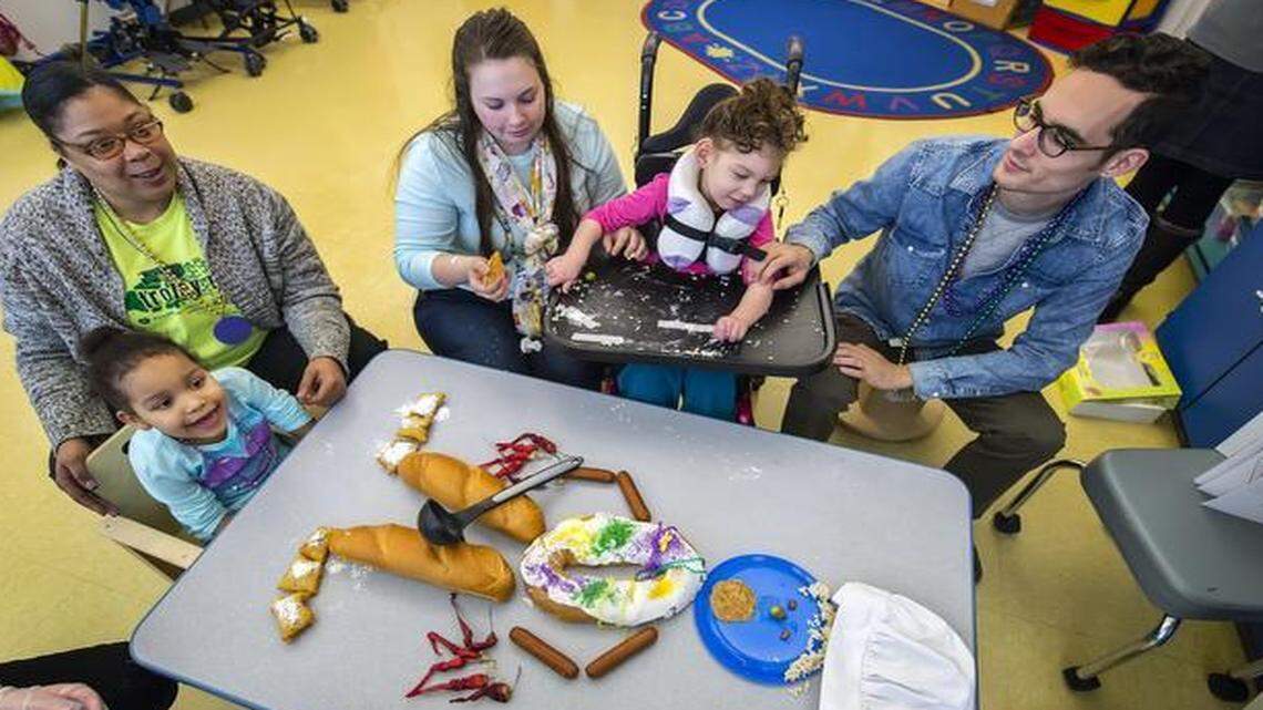 
Sahiya Garcia, 5 (from left), Trina Morrison, Michelle Stump, Josie Pritchard, 5, and Levi McPeak work on a classroom project assembling Chef Creole, a character from a children’s book, at the Children’s Center for the Visually Impaired. 




