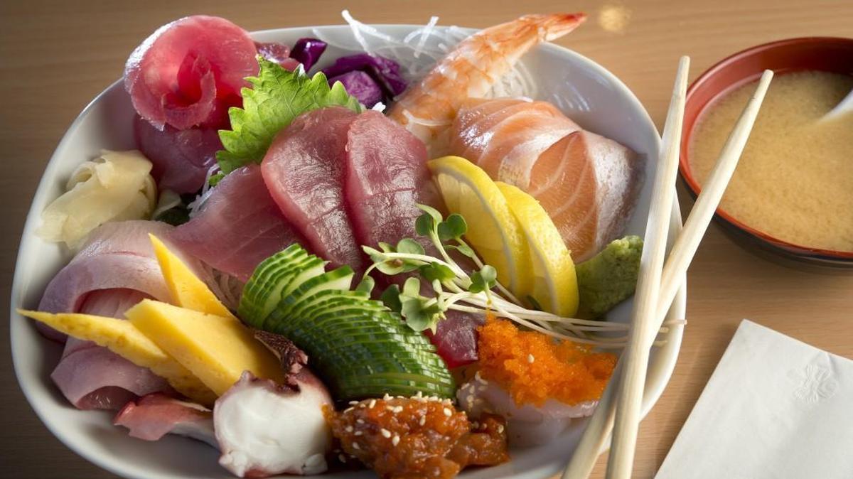 The chirashi bowl at Bob Wasabi Kitchen features an assortment of sashimi: maguro (tuna, center), yellowtail (left), salmon, shrimp, octopus, sweet baked egg and squid, all served over rice.