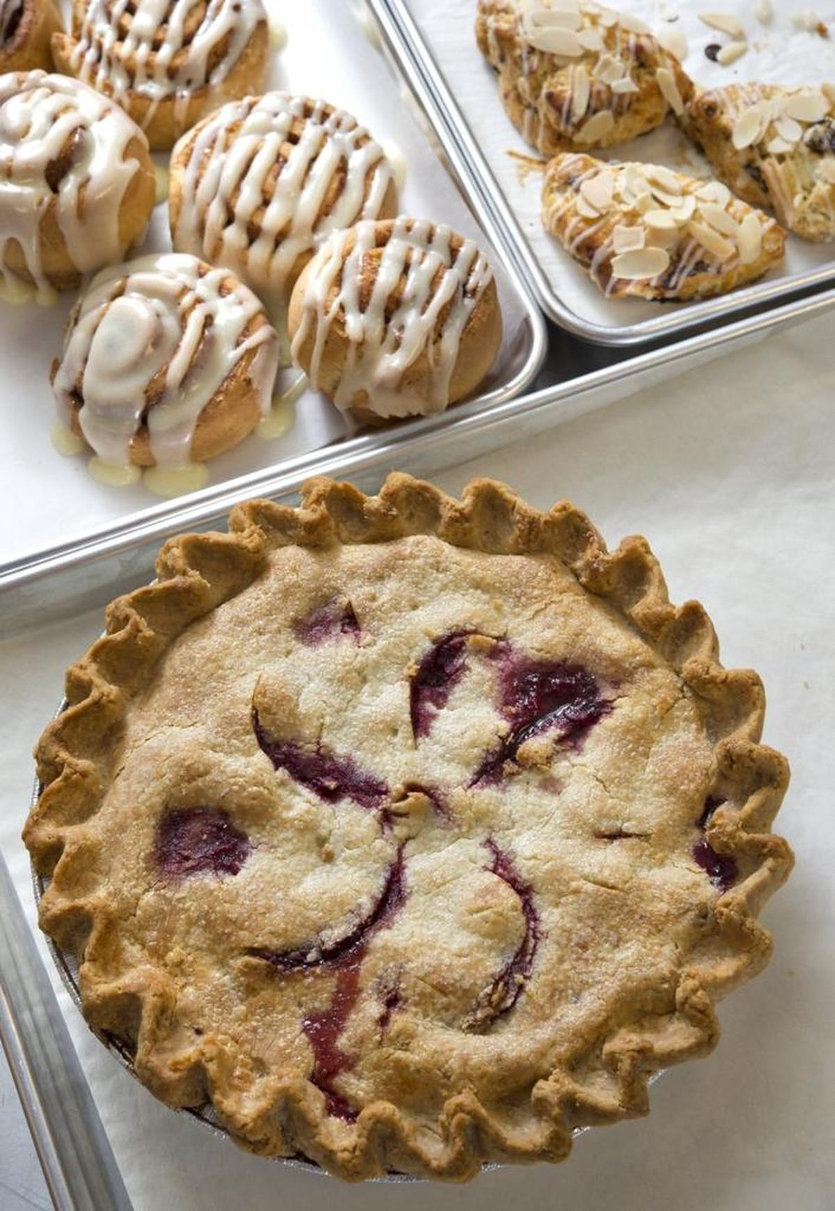 Gluten-free cinnamon rolls, scones and a cherry pie, made by Emily Kate’s.