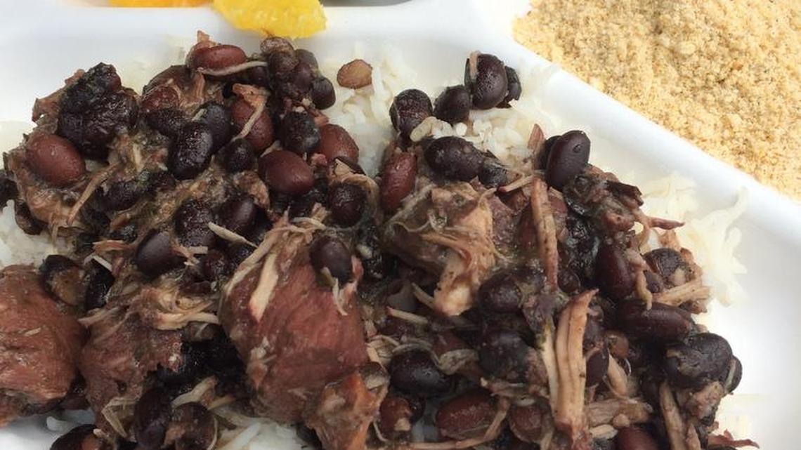 
Feijoada, a black bean stew, served with oranges, collard greens and manioc flour, is considered Brazil’s national dish.
