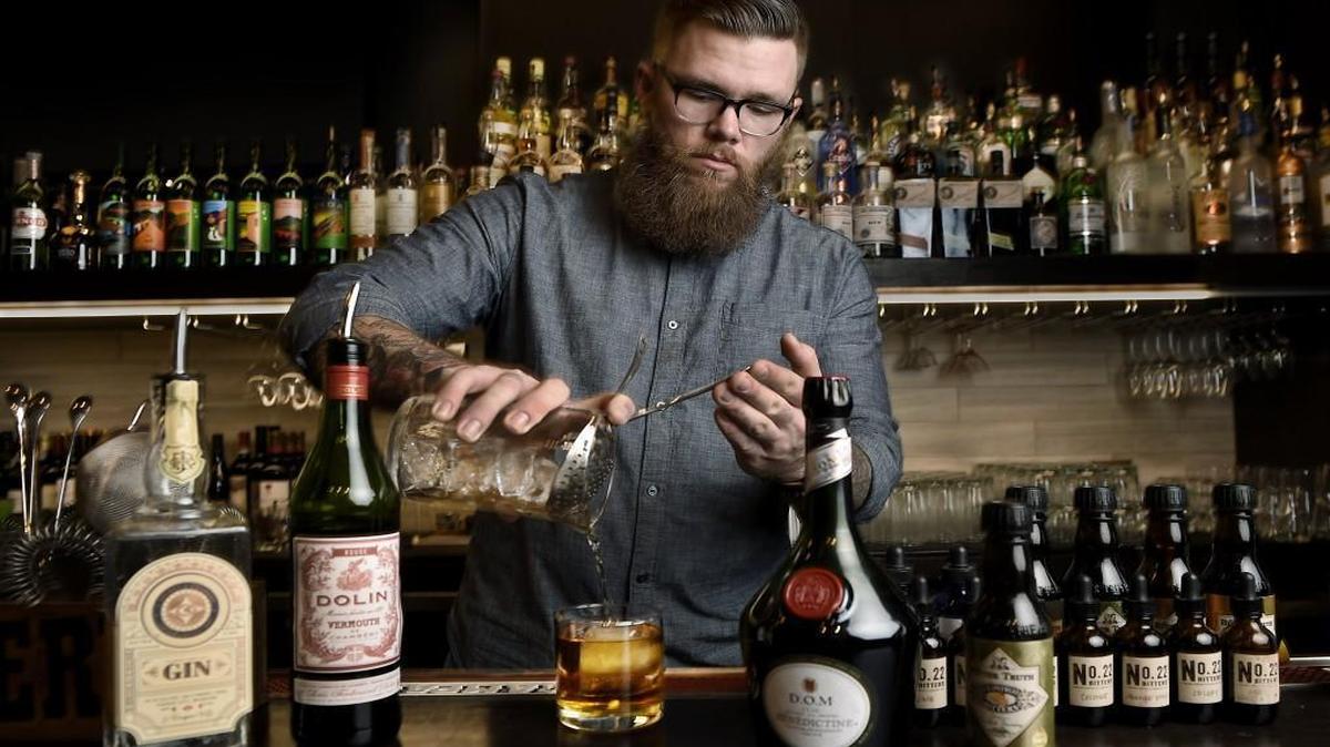 Andrew Olsen, bar manager at Bluestem Restaurant, pours a Longfellow.