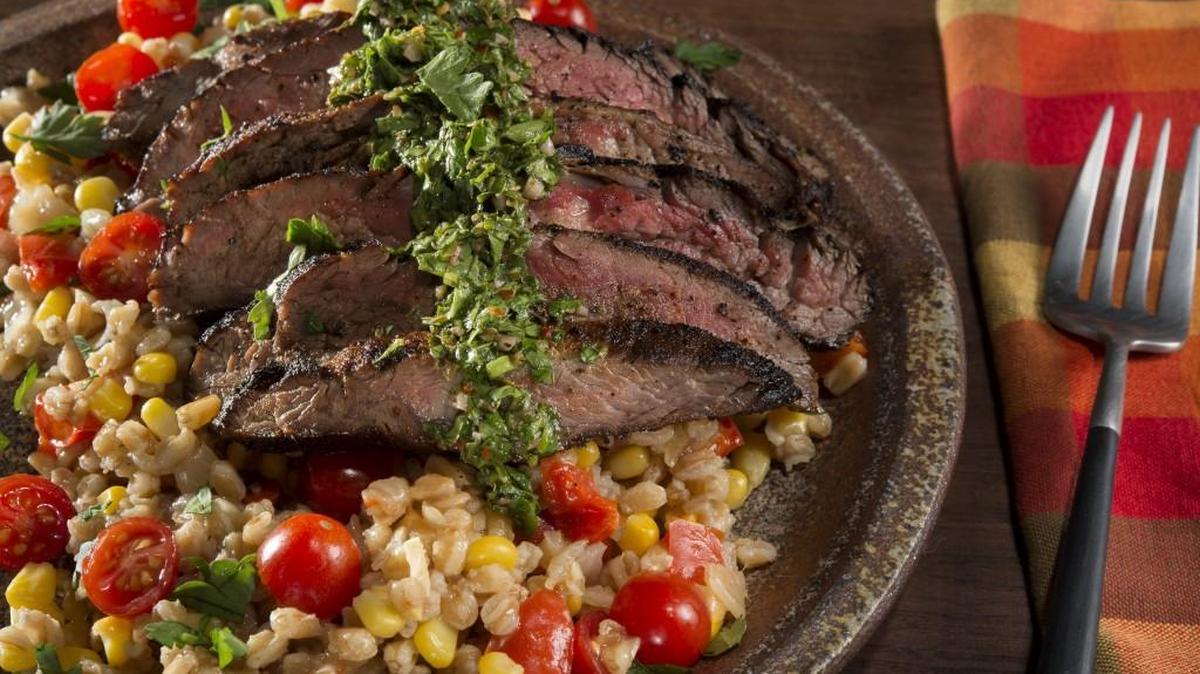 Grilled Flank Steak With Chimichurri Sauce and Farro Pilaf is one of Frank and Jayni Carey’s favorite recipes in their “New Kansas Cookbook.”