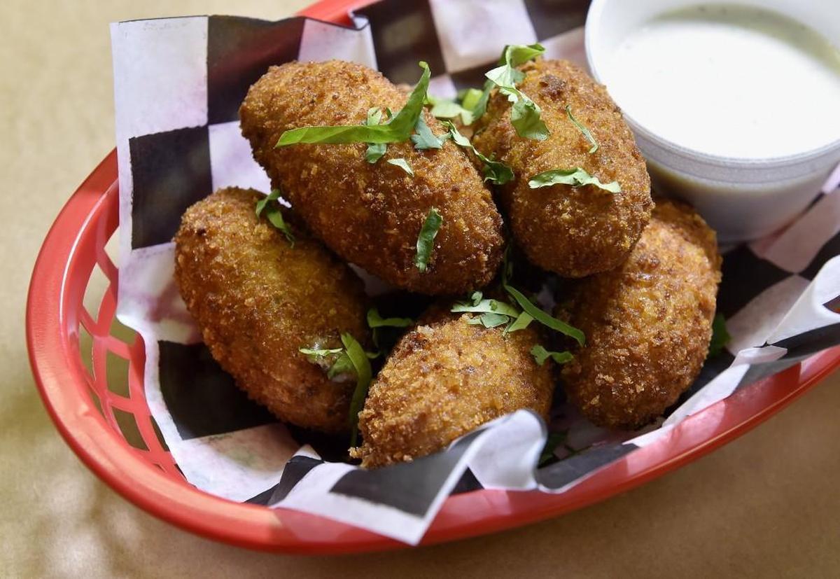 Texas Torpedoes: creamy cheddar, smoked pork and jalapeño fried nuggets with house ranch dressing.