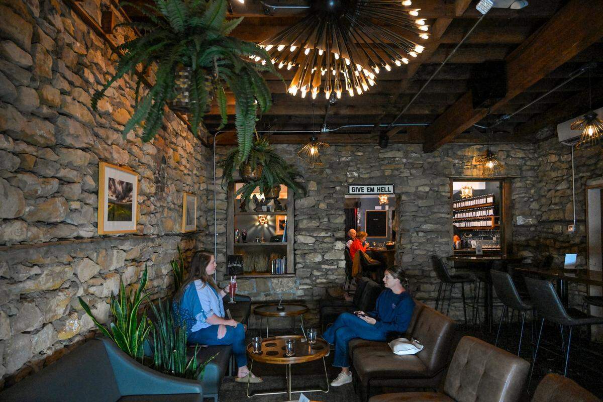 Drastic Measures is located in an 1,100-square-foot room in a Shawnee stone building that dates to the 1850s. Faryle Barthuly, left, of Lenexa, and Reilly Oliver of Westwood Hills met there for drinks over a recent happy hour. 