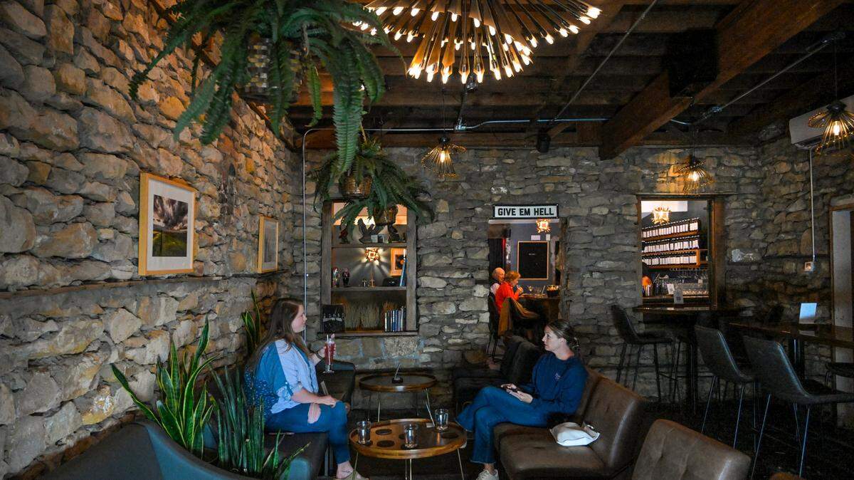 Drastic Measures is located in an 1,100-square-foot room in a Shawnee stone building that dates to the 1850s. Faryle Barthuly, left, of Lenexa, and Reilly Oliver of Westwood Hills met there for drinks over a recent happy hour. 