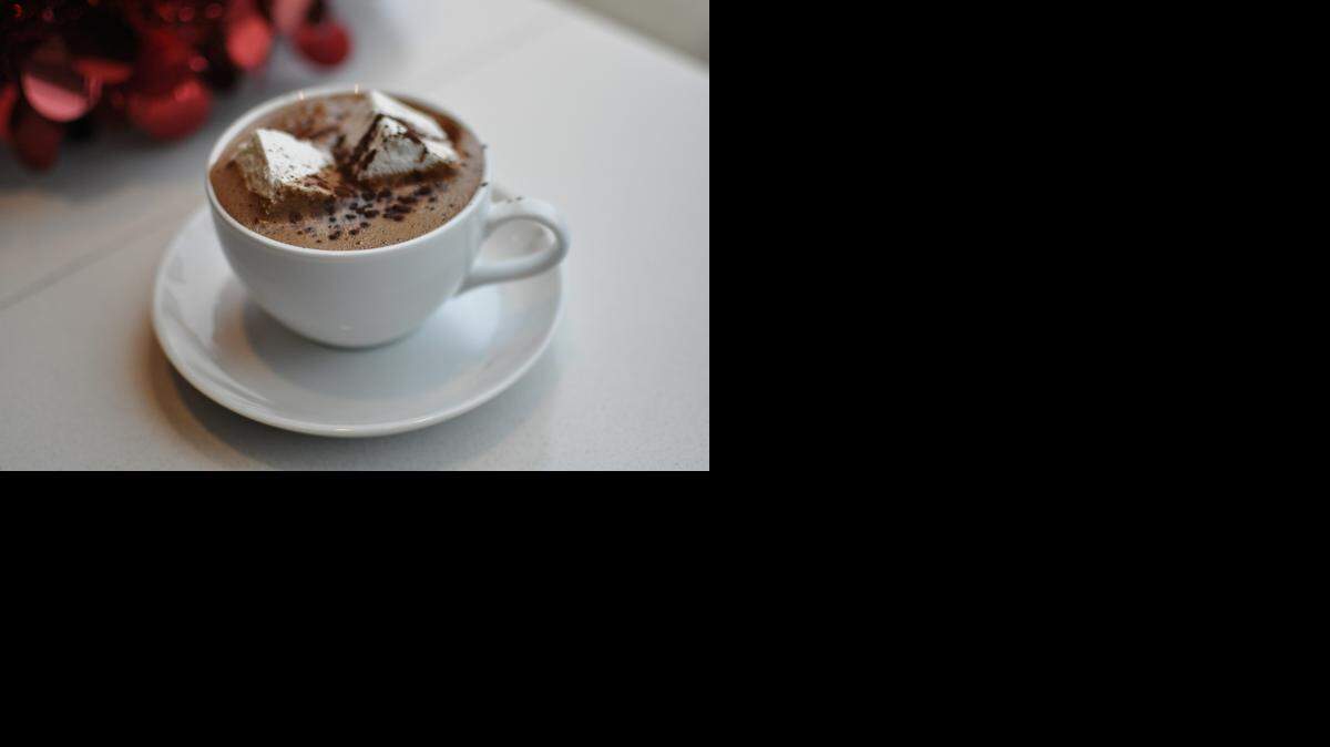 
The Venezuelan Spice drinking chocolate at Christopher Elbow Artisan Chocolates gets extra warmth from ancho and chipotle chili. Order it with whipped cream or vanilla marshmallows (shown here). 
