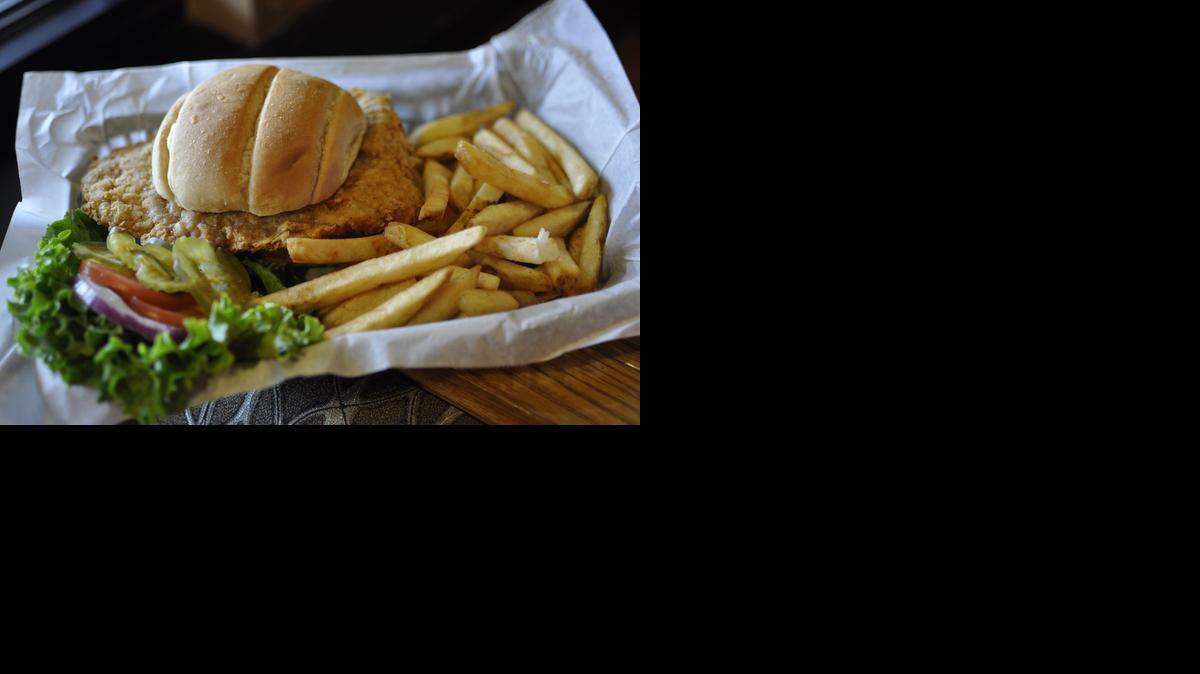 
The “Killer Tenderloin” at Paul & Jack’s Tavern features an 8-ounce hand-breaded pork cutlet. The sandwich comes with full-strength horseradish on the side.
