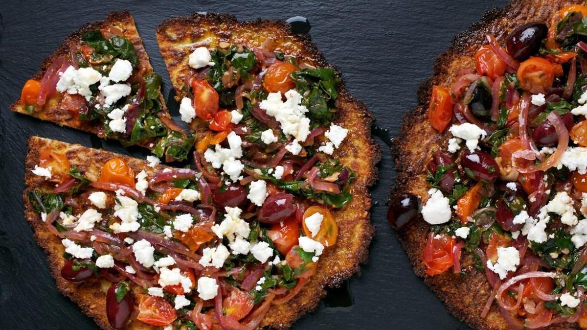For Cauliflower Pizzas With Chard and Olives, cook the topping separately and add it to the baked crust.