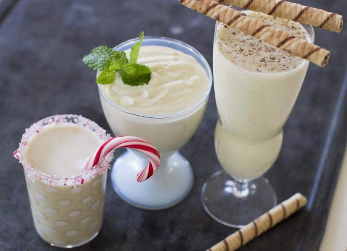 White chocolate peppermint eggnog (from left), light and airy eggnog and classic eggnog can be made using the same base recipe.
