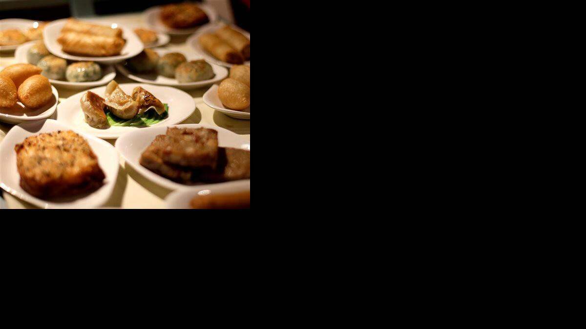 
In this photo taken Saturday, July 5, 2014, a variety of dishes are displayed on a dim sum food cart at Bo Lings Chinese restaurant in Kansas City, Mo. In a city known for barbecue, the eatery offers an alternative to ribs by offering dim sum on weekends. 
